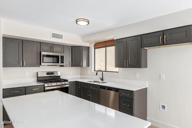 kitchen featuring stainless steel appliances and sink