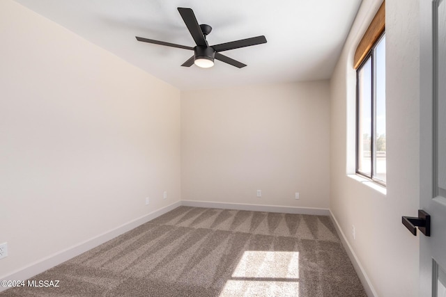 carpeted empty room featuring ceiling fan