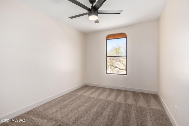 unfurnished room featuring carpet flooring and ceiling fan