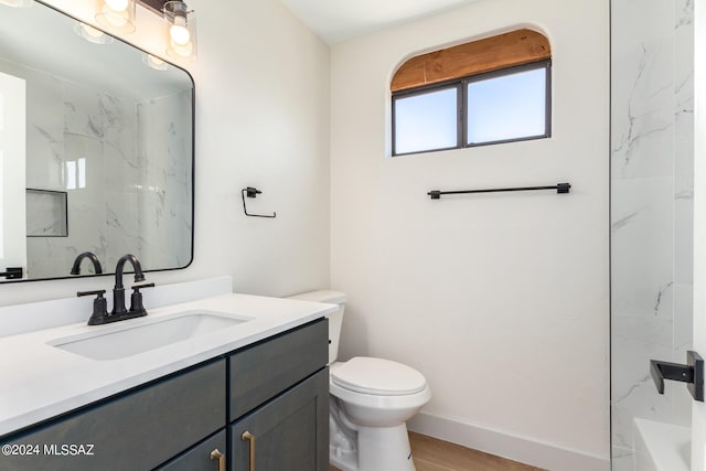 bathroom featuring hardwood / wood-style flooring, vanity, and toilet