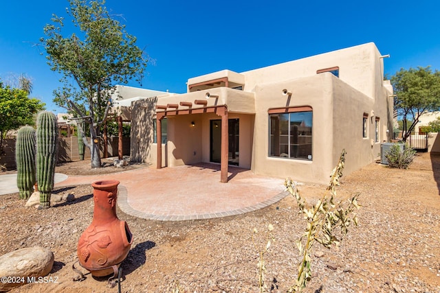 rear view of property featuring cooling unit