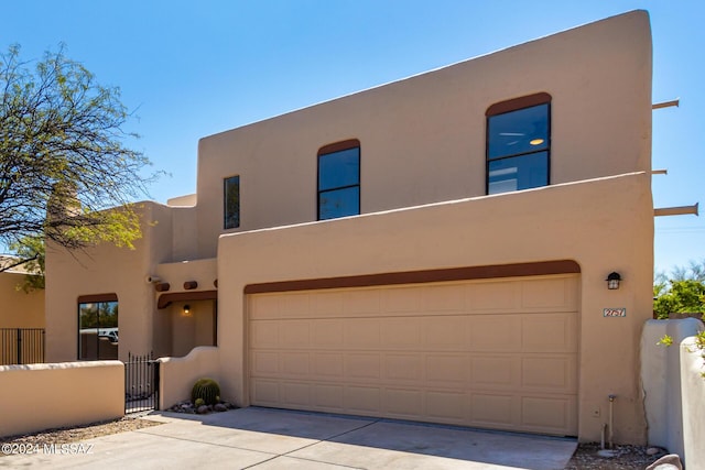 adobe home featuring a garage