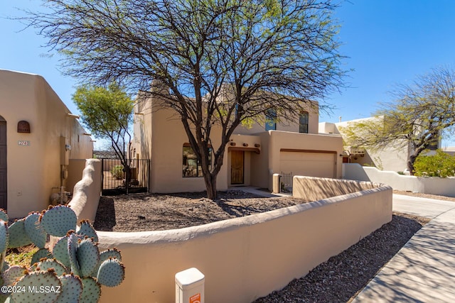 southwest-style home featuring a garage