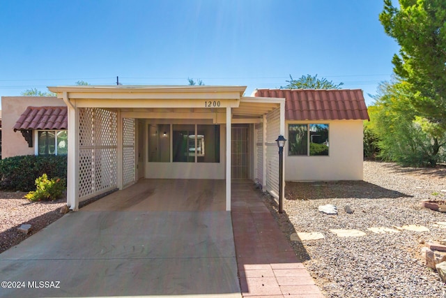 view of front of home featuring a carport