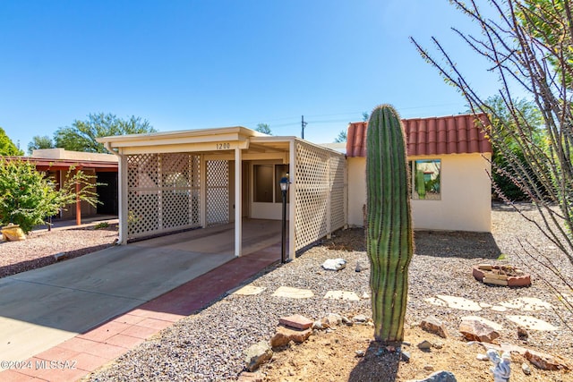 exterior space featuring a carport