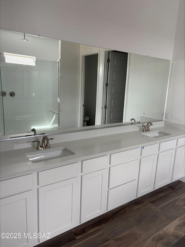 6650 W Winding Knoll Pl, Marana, AZ 85658 - bathroom featuring double vanity, toilet, a shower, and a sink