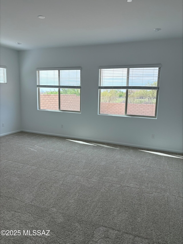 6650 W Winding Knoll Pl, Marana, AZ 85658 - carpeted spare room with a healthy amount of sunlight, recessed lighting, and baseboards