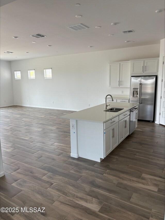 6650 W Winding Knoll Pl, Marana, AZ 85658 - kitchen featuring white cabinetry, a sink, appliances with stainless steel finishes, and visible vents