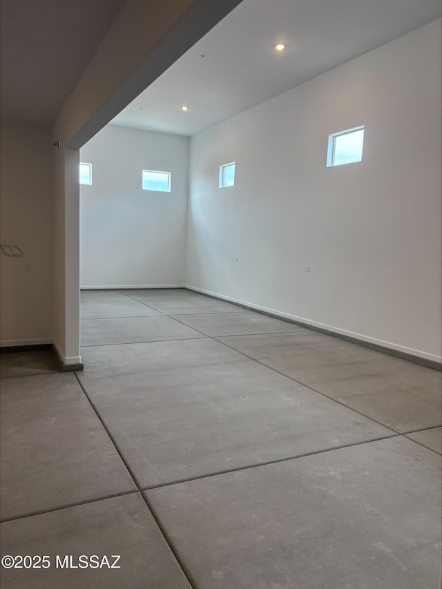 6650 W Winding Knoll Pl, Marana, AZ 85658 - below grade area with baseboards, recessed lighting, and plenty of natural light