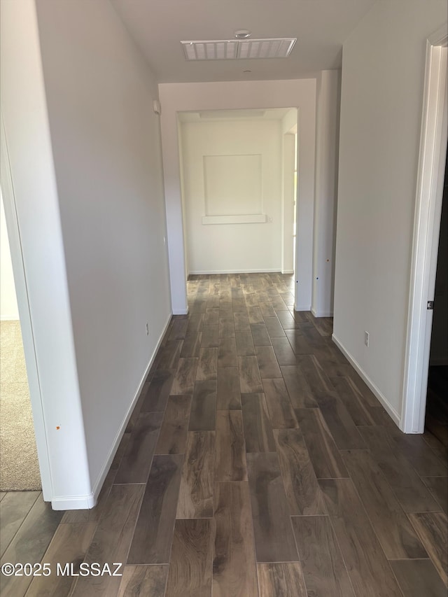 6650 W Winding Knoll Pl, Marana, AZ 85658 - hallway featuring visible vents, wood finished floors, and baseboards