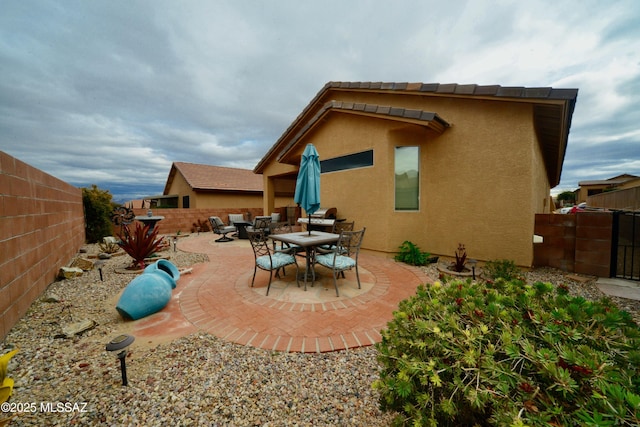 back of house with a patio area