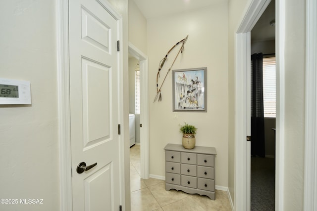 corridor featuring light tile patterned flooring