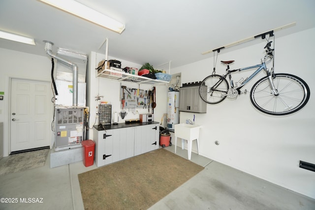 garage featuring water heater and sink