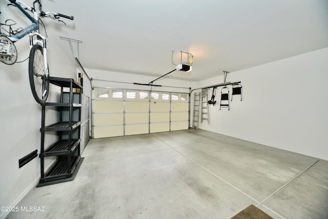 garage featuring a garage door opener