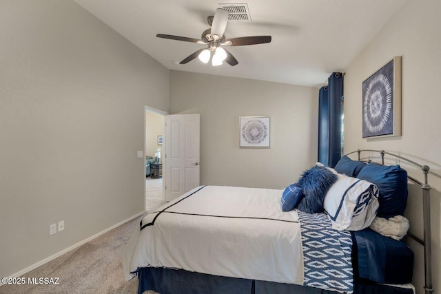 carpeted bedroom featuring baseboards, visible vents, vaulted ceiling, and a ceiling fan