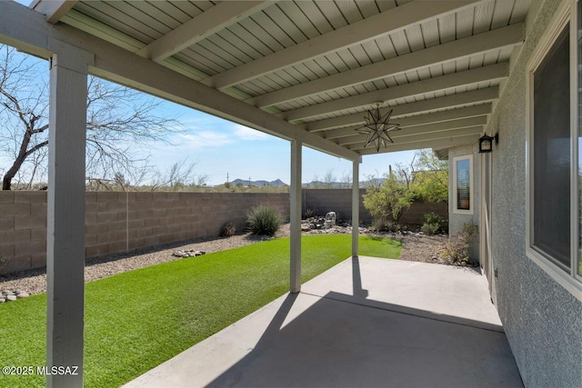 view of patio featuring ceiling fan and a fenced backyard