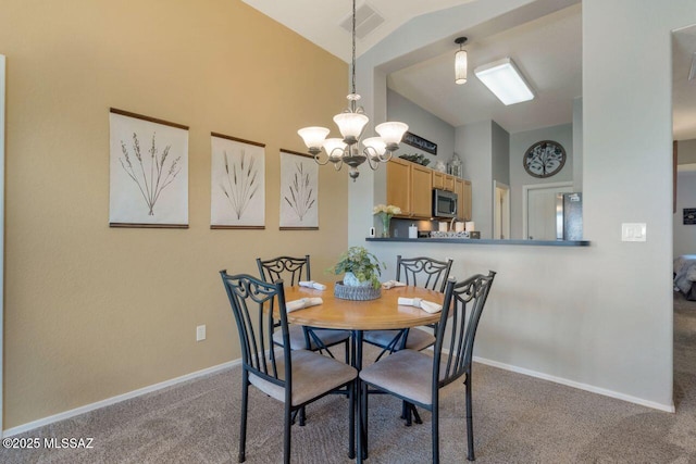 dining room with lofted ceiling, an inviting chandelier, baseboards, and light colored carpet