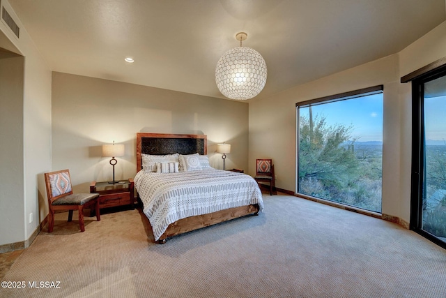 bedroom featuring carpet flooring and multiple windows