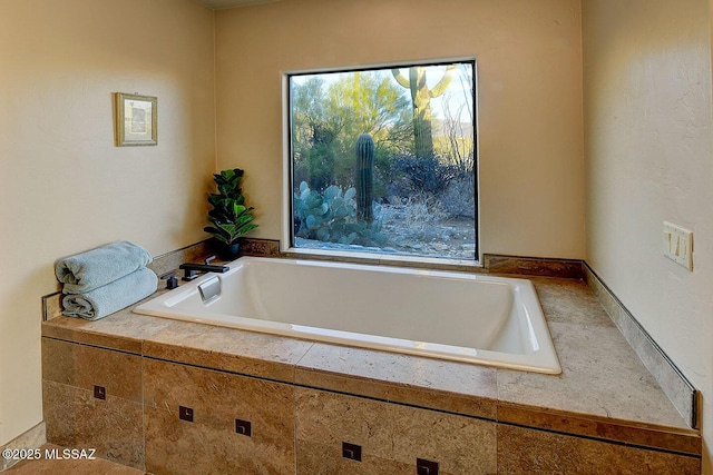 bathroom with tiled tub