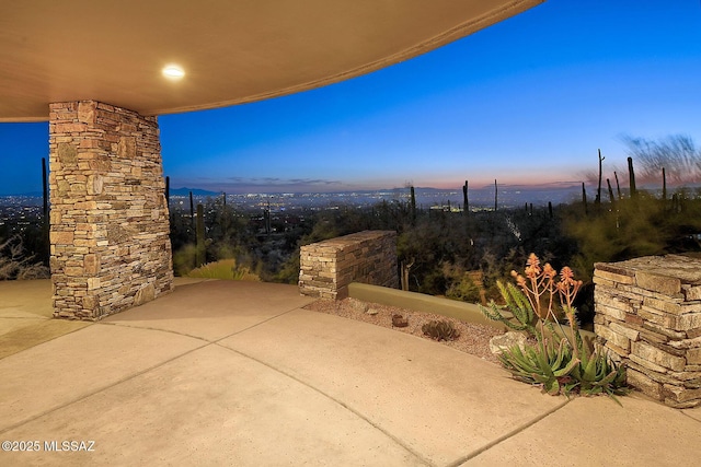 view of patio terrace at dusk