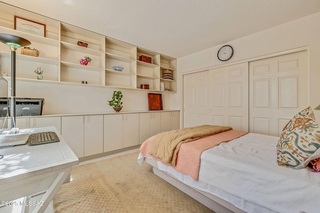 bedroom with a closet and light colored carpet