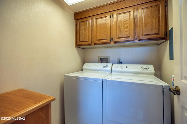 laundry area featuring cabinet space and separate washer and dryer
