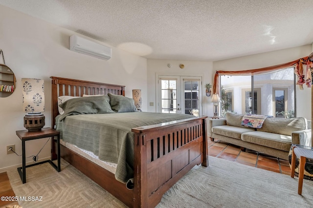bedroom with a wall mounted air conditioner, access to exterior, multiple windows, and a textured ceiling
