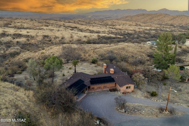 aerial view at dusk with a mountain view