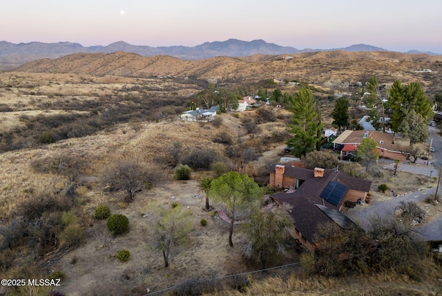 aerial view at dusk with a mountain view