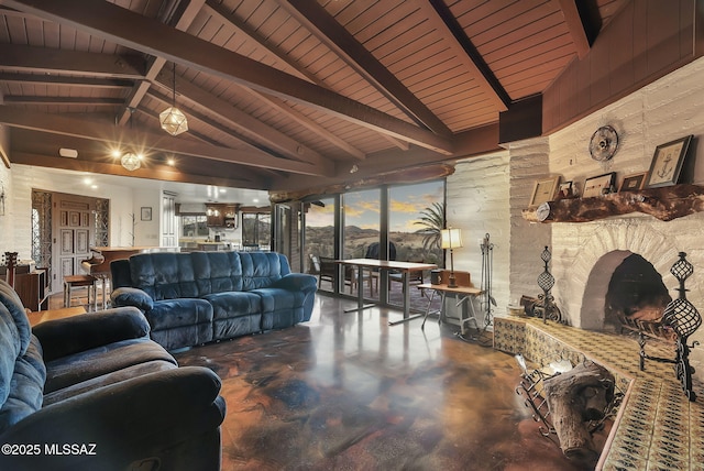 living room featuring vaulted ceiling with beams and concrete floors