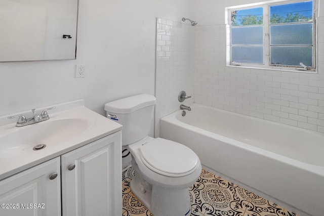 full bathroom with vanity, tile patterned flooring, toilet, and tiled shower / bath