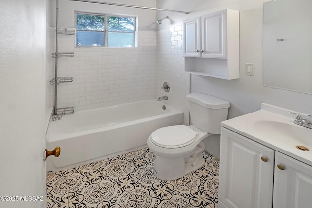 full bathroom with vanity, tiled shower / bath, tile patterned floors, and toilet