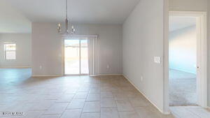 interior space with a chandelier and light tile patterned floors