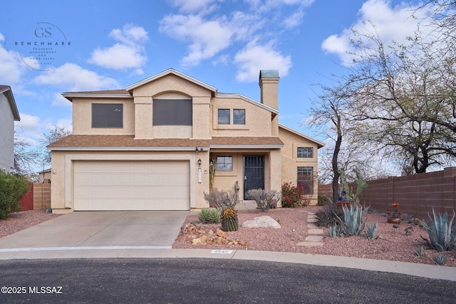 traditional-style home with stucco siding, driveway, fence, an attached garage, and a chimney