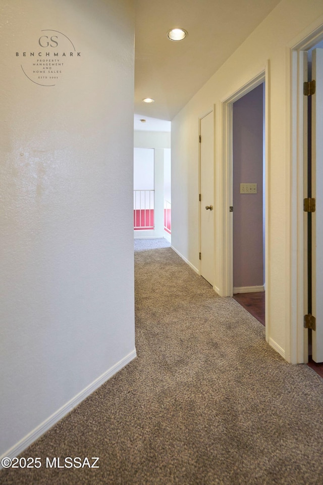 corridor with recessed lighting, carpet, and baseboards