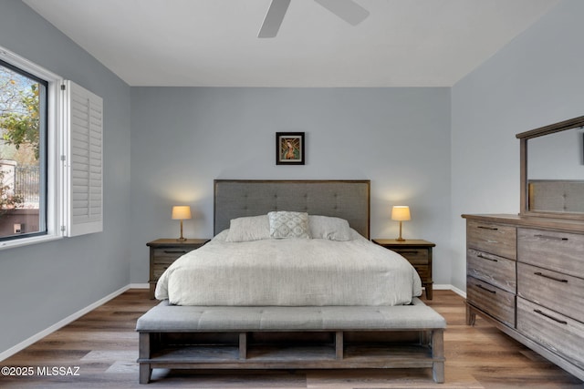 bedroom featuring wood-type flooring and ceiling fan