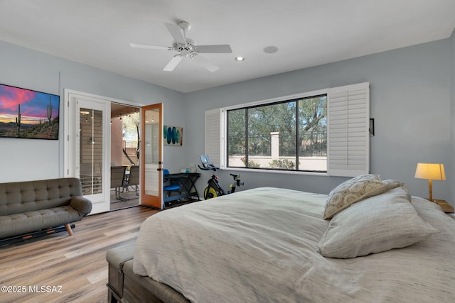 bedroom with hardwood / wood-style flooring, access to exterior, and ceiling fan