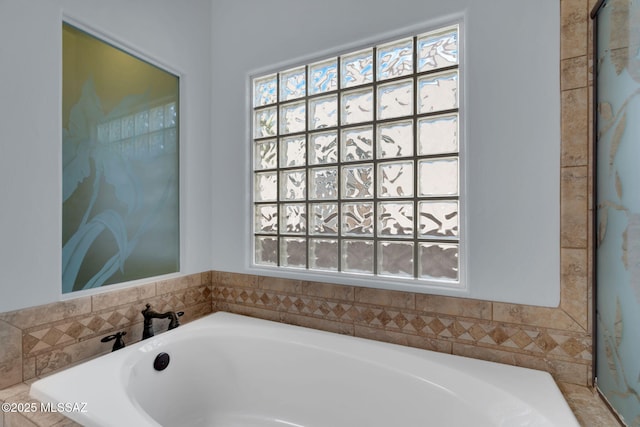 bathroom featuring a tub to relax in