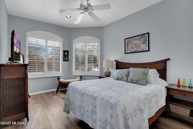 bedroom featuring hardwood / wood-style floors and ceiling fan