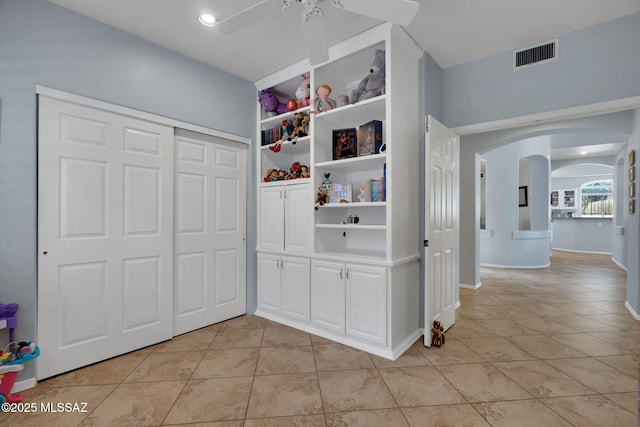 corridor featuring light tile patterned flooring