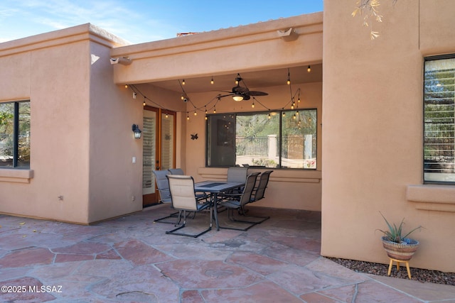 view of patio / terrace featuring ceiling fan