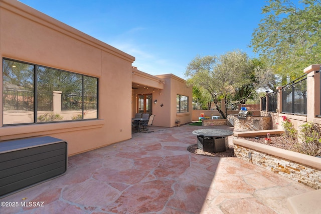 view of patio / terrace with a fire pit