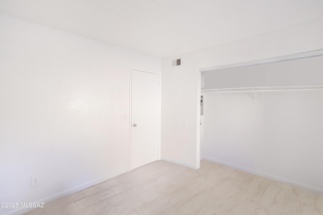 unfurnished bedroom with a closet