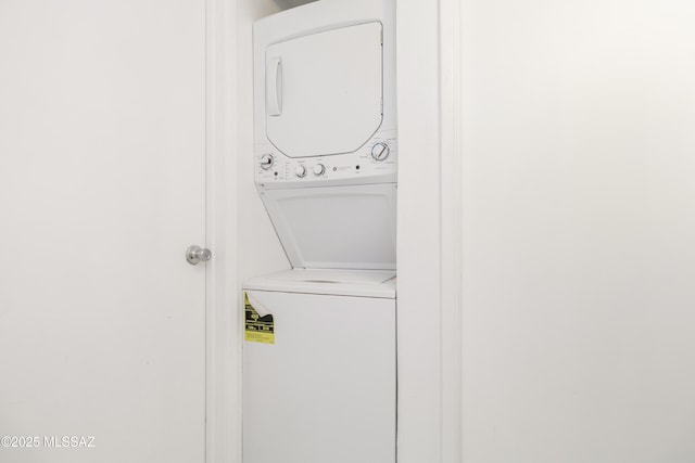 laundry room featuring stacked washer and dryer