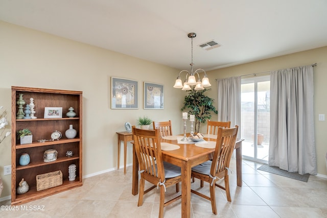 dining room with a chandelier, light tile patterned floors, visible vents, and baseboards