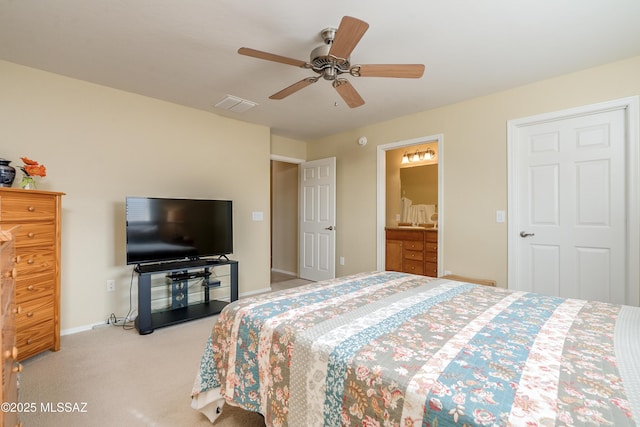 bedroom with visible vents, light carpet, connected bathroom, ceiling fan, and baseboards