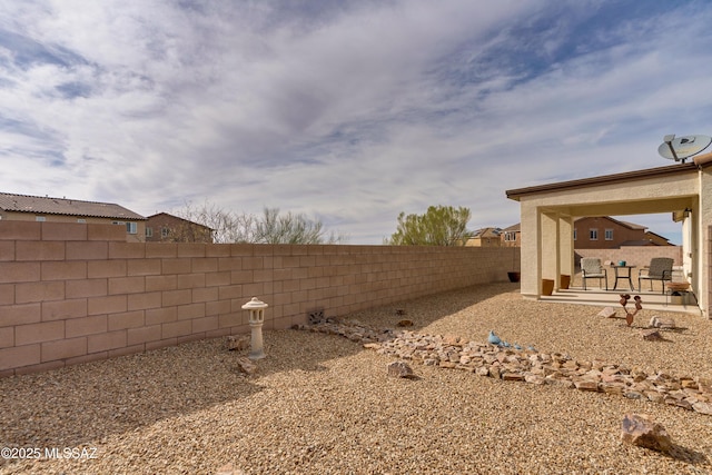 view of yard featuring a fenced backyard and a patio