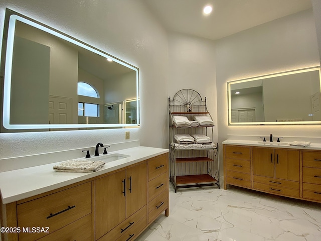 bathroom featuring vanity and walk in shower