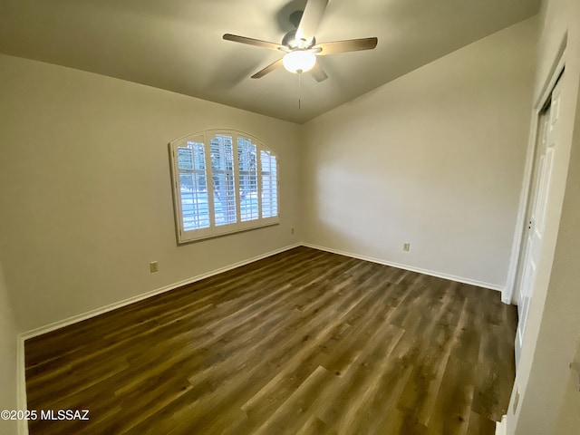 unfurnished bedroom with dark hardwood / wood-style flooring, a closet, and ceiling fan