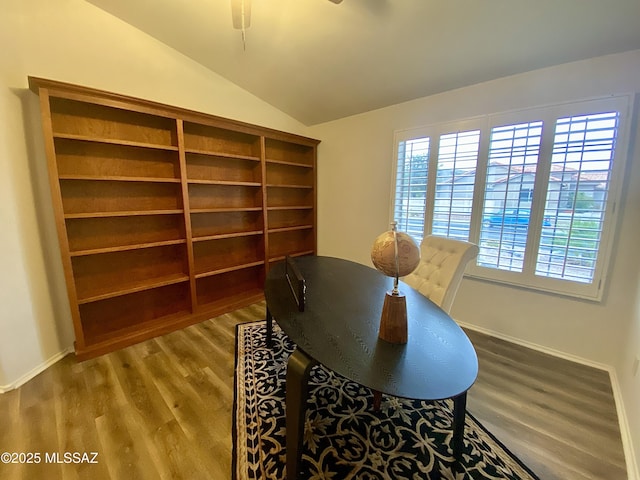 office with lofted ceiling, hardwood / wood-style flooring, and a healthy amount of sunlight